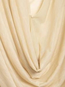 Detail of soft cream knitted fabric showing lightweight texture and natural drape