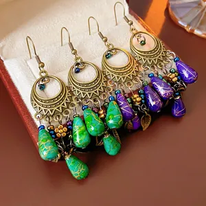 Bohemian retro bronze hollow earrings with green and purple water-drop resin beads