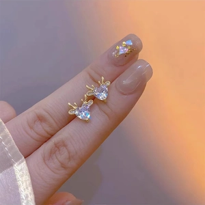 Sparkling zircon elk ear studs with golden heart design and white crystals for women
