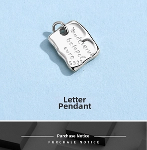 Macro view of S925 sterling silver tag with believe engraving for DIY jewelry