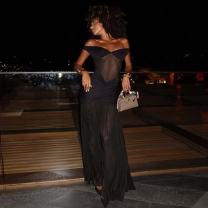 Detail view of black off-shoulder maxi dress with mesh inserts and corset styling
