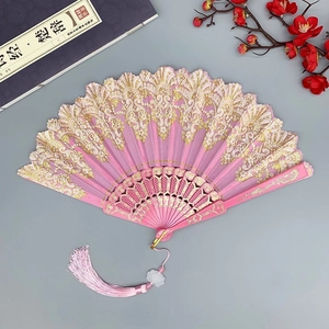 Pink folding fan with gold lace patterns, pink tassels, and decorative plum blossoms