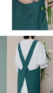 Detail of teal cotton linen apron featuring H-back cross straps and a large rear pocket