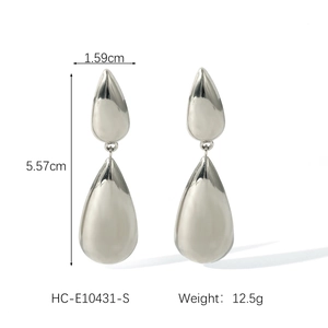 Detail showing dimensions of silver teardrop earrings measuring 5.57cm by 1.59cm