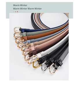 Detail view of colorful narrow women's PU belts with classic polished metal pin buckles