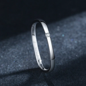 Elegant S925 sterling silver square ring with a single zircon on dark textured background