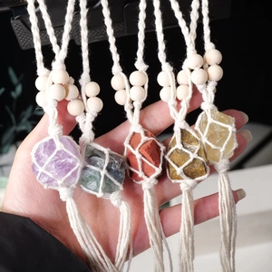 Handcrafted bohemian macrame stone hangers with raw crystals and natural wood beads