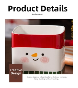 Close-up of square ceramic mug featuring a festive snowman pattern and vibrant red holiday hat