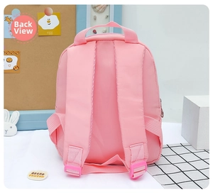 Detailed back view of pink kids backpack showing adjustable padded straps and top handle