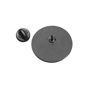 Detailed view of black metal circular pin base and matching rubber clutch backings