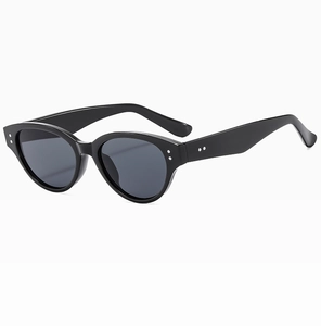 Detailed side view of black cat-eye sunglasses with silver rivets on polished frame