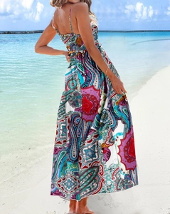 Detail of summer backless maxi dress featuring paisley print and thin spaghetti straps