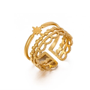 Golden multi-layer open ring featuring star charm and beaded lace textured bands