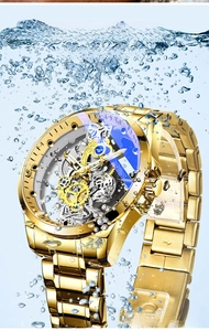 Action shot of gold automatic skeleton watch submerged in water showing 30M water resistance