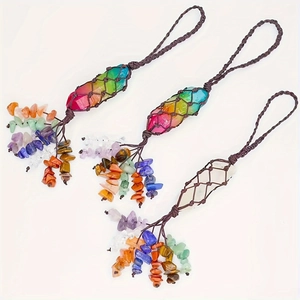 Detail of handmade chakra crystal hanging with woven netting and colorful stone tassels