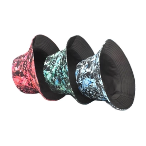 Three tie-dye marble pattern bucket hats in red, green, and blue with black lining