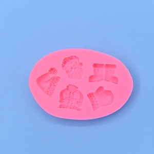 Pink Christmas silicone mold featuring Santa Claus boots and gloves for DIY cake baking