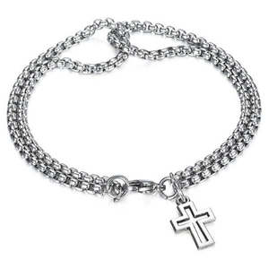 Macro detail of silver titanium double-chain bracelet with hollow cross pendant and lobster clasp
