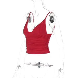 Detail shot of the V-neckline and ruched texture on the red cropped camisole top