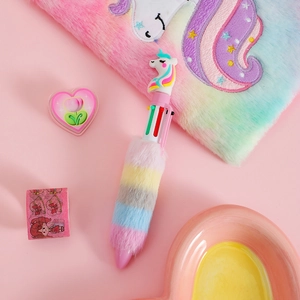 Close-up of fluffy unicorn notebook and multi-color plush ballpoint pen set