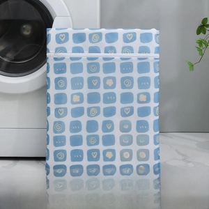 Detail of 50x60cm large laundry bag featuring blue checkered rabbit and heart patterns