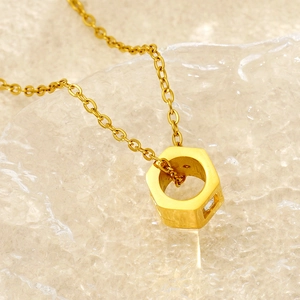 Fashionable gold stainless steel necklace with a diamond-set hexagonal 3D pendant