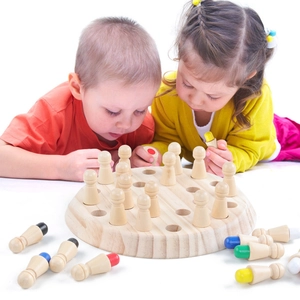 Children playing with wooden memory chess game for cognitive development and focus training