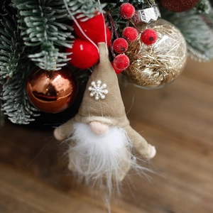 Plush Christmas Gnome hanging ornament with pearl snowflake on tree branch