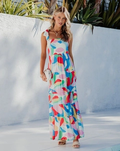 Close-up of vibrant geometric print maxi dress with adjustable tie straps for summer