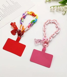 Detail of colorful acrylic bear charms and chain straps for phone wristlets