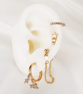 Close-up of gold geometric ear cuff set with micro-pave zircons on a silicone ear model