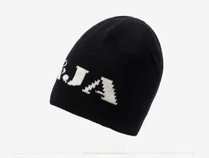 Detail shot of black ribbed knit beanie featuring white jacquard letter embroidery