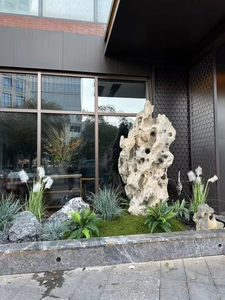 Detailed landscape decor with artificial moss, faux ferns and natural landscape stone