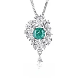 Close-up of S925 silver necklace featuring a cushion-cut emerald pendant with zircon halo