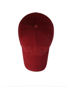 Bird's eye view of a burgundy baseball cap with 3D embossed BLACK and blue embroidery
