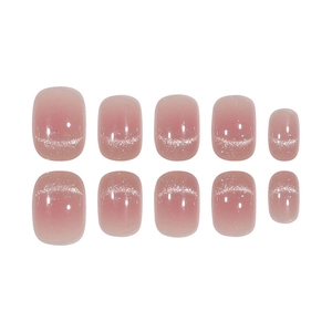 Close-up of pink gradient cat eye press-on nails with shimmering magnetic glitter effect