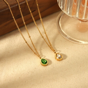 Titanium steel necklaces with green and champagne teardrop crystals on gold satellite chains