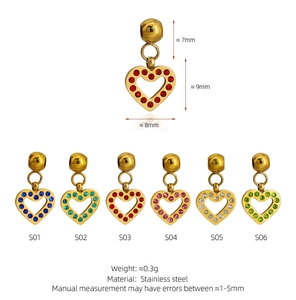 Detail view of colorful rhinestone heart pendants in stainless steel showing sizing