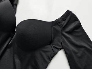 Detailed macro view of black push-up bra cups with high-quality seamless stitching details