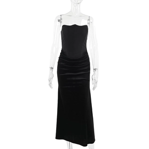 Detail showing high-quality black velvet fabric texture and slim-fit corset waist of the dress