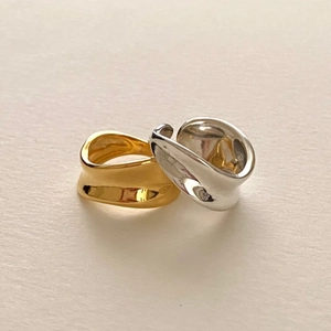 Irregular organic wave design rings in gold and silver finish with mirror polished texture
