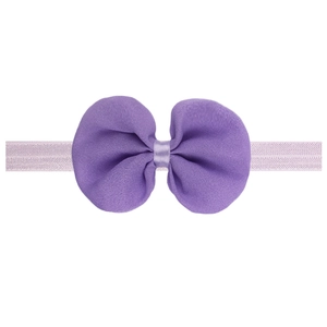 Detail of a purple chiffon bow headband for infants with elastic knitted fabric strap