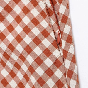 Red and white checkered skirt set featuring a side invisible zipper and premium fabric