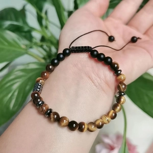 Morse Code Soul Sister bracelet with yellow tiger eye and black matte beads on wrist