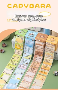 Macro shot of pull-out cartoon sticky notes with capybara and panda designs for journaling