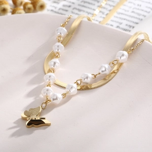 Gold double-layered necklace featuring butterfly pendant and faux pearl snake bone chain
