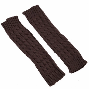 Detail view of dark brown cable knit leg warmers showing soft textured weave