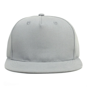 Detail view of neutral gray flat brim hip hop hat showing twill cotton texture and stitching