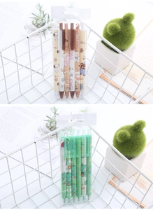 Detail of cute assorted bear and dinosaur gel pens in organized desktop storage baskets