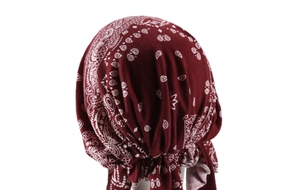 Detail view of burgundy paisley headwrap showing high-quality stitching and fabric texture